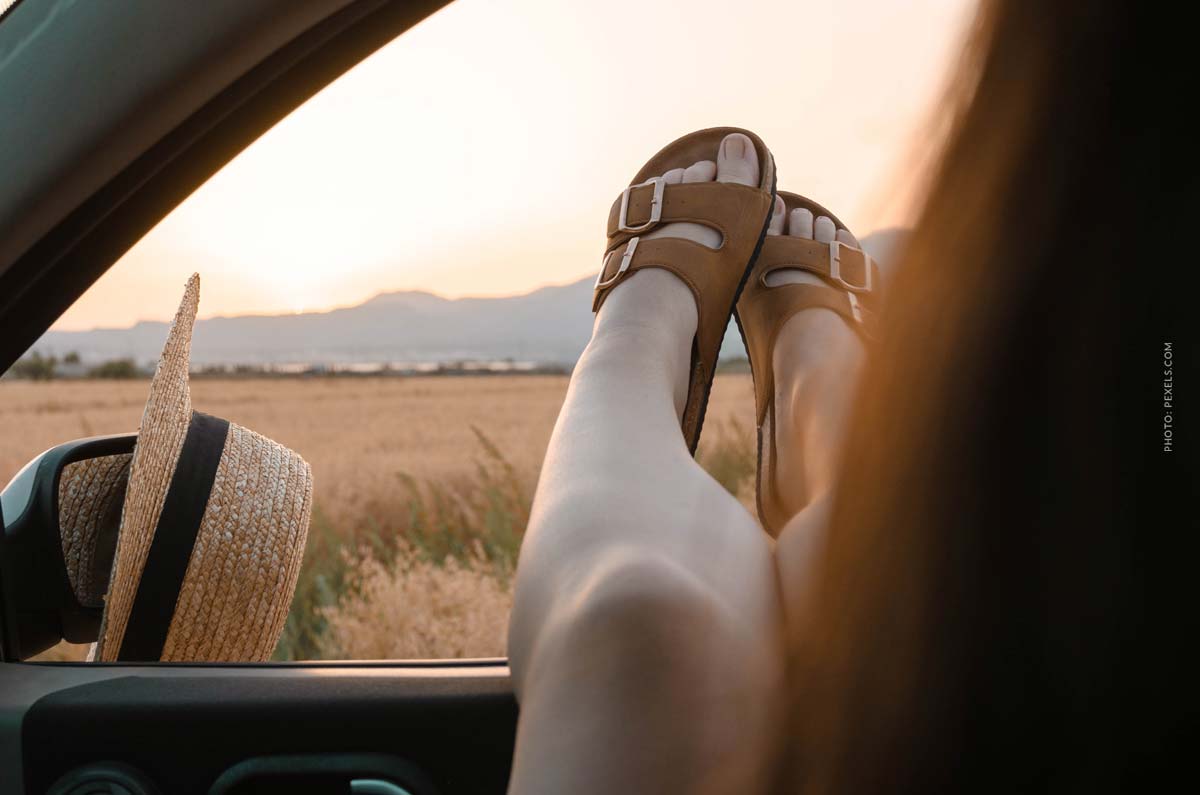 Birkenstock: brand, shoes, designer collaborations and the famous cork sole birkenstock-fashion-brand-shoes-gril-sitting-in-car-with-birkenstocks-on-legs-outside-the-window