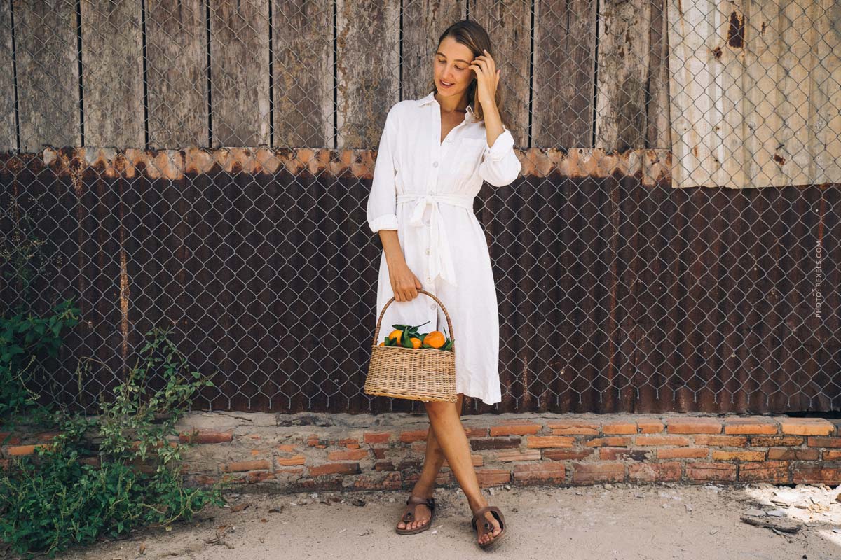 birkenstock-fashion-brand-shoes-woman-in-birkenstocks-white-dress-with-fruits