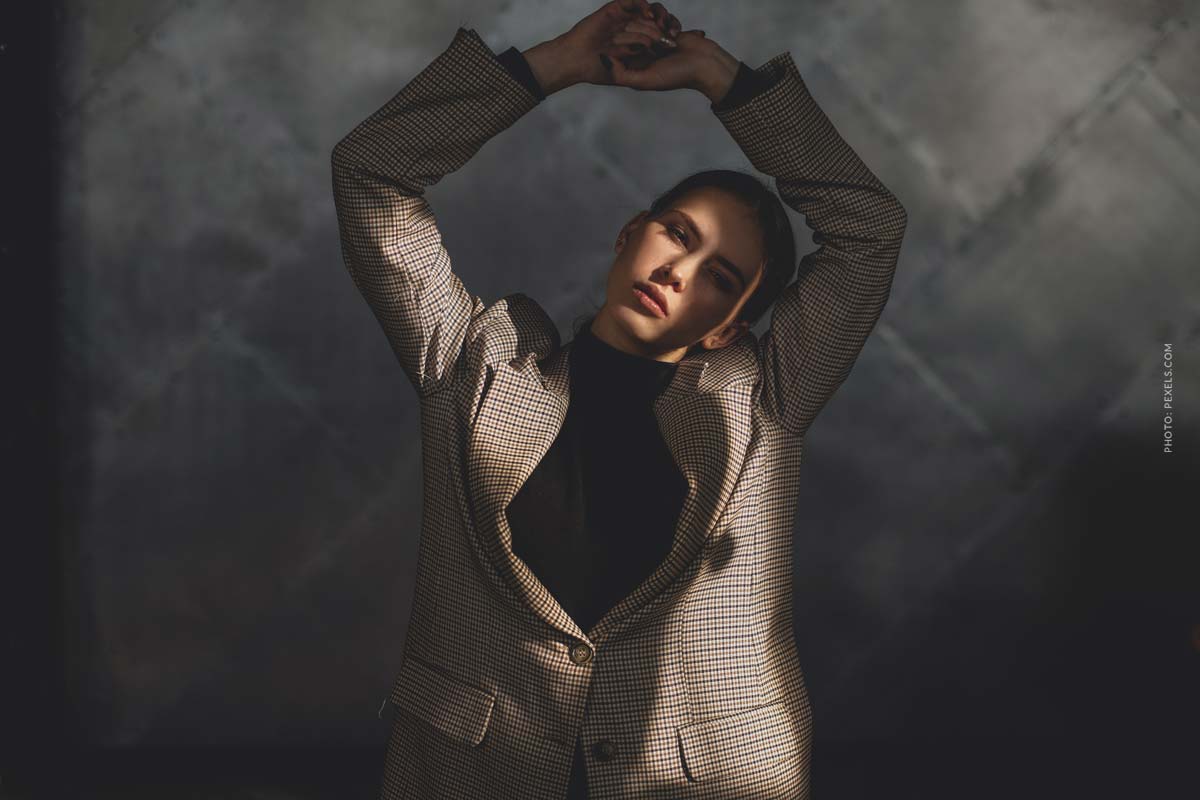 fashion-brand-max-mara-videos-woman-in-a-brown-blazer-and-hands-above-head